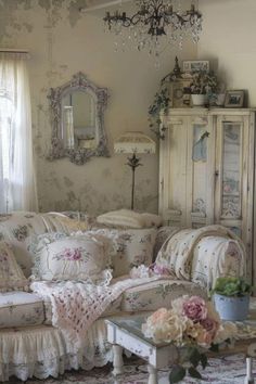 a living room filled with furniture and a chandelier