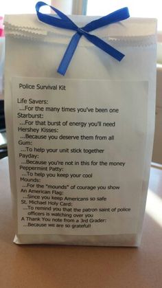 a bag with a poem written on it and a blue ribbon tied around the top