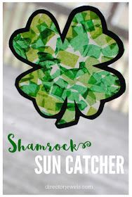 a shamrock made out of tissue paper with the words shamrock sun catcher on it in front of