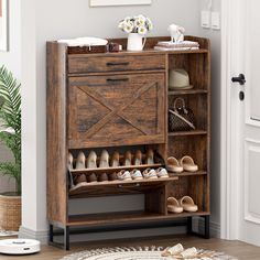 a wooden shoe rack with shoes on it in front of a door and potted plant