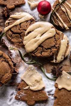 some cookies with icing and cinnamon on top