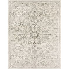 a rug with an ornate design on the front and back side, in grey tones