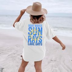 Hey there, sunshine! Are you ready to bask in the warmth of sun rays and embrace the joy of lake days? The "Sun Rays Lake Days Blue Back Design" Comfort Color Tee is the perfect blend of sunshine and lakeside charm, now with a stylish back design! Crafted from premium Comfort Color fabric, this tee feels as soft and comforting as a gentle summer breeze. The vibrant "Sun Rays Lake Days Blue Back Design" graphic on the back celebrates the beauty of sunny days and lakeside adventures. Whether you'r Upf 50+ Crew Neck Swimwear For Summer, Summer Short Sleeve Tops With Uv Protection, Summer Tops With Uv Protection And Short Sleeves, Blue Beach Tops With Upf 50+, Blue Tops For Beach With Upf 50+, Upf 50+ Short Sleeve Beach Tops, Upf 50+ Short Sleeve Beachwear Tops, Beachy Upf 50+ Tops For Spring, Blue Summer Tops With Uv Protection