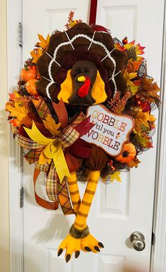 a door hanger decorated with a turkey