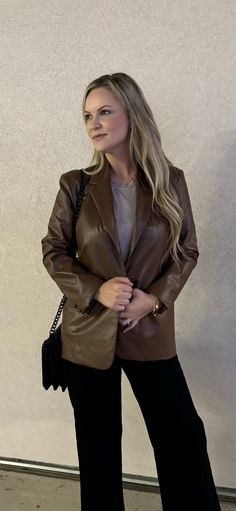 Out luxurious Cambridge Faux Leather Blazer is a must-have for any wardrobe. Crafted from brown faux leather, this blazer is both stylish and comfortable. It's the perfect addition to any outfit, whether you're heading to the office or on a night out. Runs slightly small. Model is wearing a Medium. Brown Office Blazer, Trendy Faux Leather Jacket For Business, Winter Business Faux Leather Blazer, Elegant Brown Outerwear For Office, Spring Formal Brown Blazer, Faux Leather Notch Lapel Blazer For Work, Faux Leather Notch Lapel Jacket For Office, Formal Faux Leather Blazer With Notch Lapel, Notch Lapel Faux Leather Blazer For Work