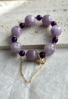 Beautiful elastic bracelet using 15mm and 8mm amethyst beads in different colors. The color and size contrast brought the bracelet a dreamy feel. Absolutely gorgeous. Get it here: https://www.etsy.com/berylcraft/listing/1323582342/chunky-amethyst-bracelet-beaded-amethyst?utm_source=Copy&utm_medium=ListingManager&utm_campaign=Share&utm_term=so.lmsm&share_time=1667340216101 Purple Crystal Bracelet For Gift, Amethyst Beaded Bracelets With Round Beads, Purple Spiritual Beaded Bangle Bracelet, Spiritual Purple Bangle Bracelet, Spiritual Purple Beaded Bangle Bracelet, Spiritual Purple Beaded Bangle Bracelets, Purple Beaded Bracelets With Stones As A Gift, Purple Gemstone Beaded Bracelets For Jewelry Making, Spiritual Purple Crystal Bangle Bracelet