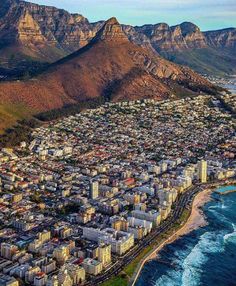 an aerial view of cape town with mountains in the background