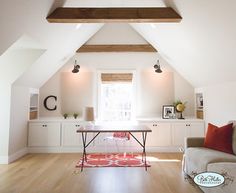 a living room filled with furniture and white walls