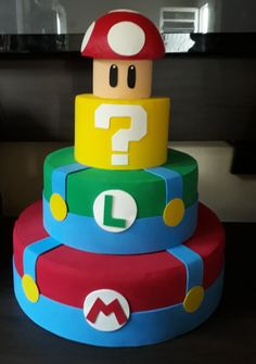 there is a cake made to look like mario's hat and question mark on it