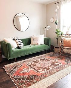 a living room filled with furniture and a rug