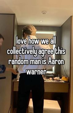 two people standing in front of a mirror with the words love bow we all collectively agree this random man is aaron warnner