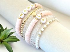 Fun, feminine Name, Initial or Word bracelet stacks make the perfect outfit accessory! Mix and match the beautiful light pink word bracelets with our accent bracelets for a pop of gold to dress up your bracelet stack.  👉🏻Bracelets are made with brass beads, high quality hypoallergenic 18k gold filled spacer beads, & heishi beads. Each bracelet sold separately.** 📌INSTRUCTIONS: 1. From the Dropdown Menu: >> * SELECT appropriate "Bracelet Length." **Please see photo provided for wrist measurement instructions. Each bracelet is custom made to size. If ordering as a gift, please measure your own west and give best educated guess. If you have any questions about sizing, please message seller. >> * SELECT from "Bracelet Options." 2. In the "Personalization Section:" >> * Advise alphabet lette Kids Name Bracelet, Pink Word, Word Bracelets, Keep Bracelet, Stackable Beaded Bracelets, Bracelets Bead, Popular Bracelets, Bracelet Stacks, Trending Bracelets