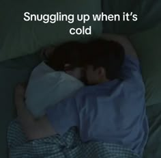 a man sleeping in bed with the caption snuggling up when it's cold