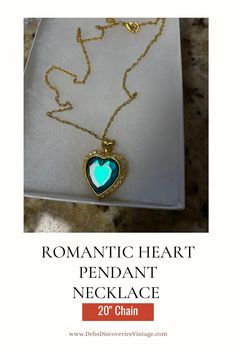 Gorgeous romantic heart pendant necklace, faceted green acrylic pendant surrounded by clear rhinestones. Goldplated setting and 20" chain.