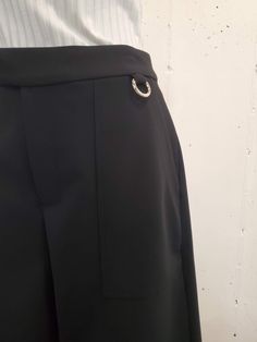 Tailored long, shorts with two front stitched patch pockets in double crepe fabric. One removable silvertone carabiner on left waistband. Info & Care 100% Polyester Dry Clean Only Made in New York Size & Fit Fits true to size, 14" inseam Returns & Exchanges Returns or exchanges available on all full priced merchandise in unworn condition, with original packaging within 14 days of receipt. All discounted merchandise is final sale. Bermuda Workwear Pants With Pockets, Wide Leg Workwear Shorts With Side Pockets, Modern Bottoms With Side Pockets And Short Length, Modern Shorts With Side Pockets, Modern Short Length Bottoms With Side Pockets, Elegant Short Length Bottoms With Side Pockets, Elegant Short Pants With Pockets, Workwear Pants With Hip Pockets, Elegant Knee-length Shorts With Pockets