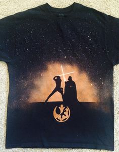 a star wars t - shirt with the silhouettes of darth vader and princess lei