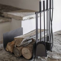 a pile of firewood sitting on top of a counter next to a spatula