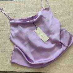 Dance And Marvel Cowl Neck Crop Satin Silk Cami. Size Medium. Color: Lavender Purple. So Cute! Flowy Top, Soft Material. Camisole With Cowl Neckline And Adjustable Straps. Fit Is Loose And Drapey. New With Tags. Never Worn. Still Has Tags. Purple Summer Party Camisole, Summer Party Purple Camisole, Spring Party Purple Camisole, Chic Fitted Purple Camisole, Elegant Purple Camisole For Summer, Elegant Purple Summer Camisole, Surprise Dance Outfits, Surprise Dance, Purple Outfit