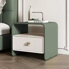 a white nightstand sitting on top of a wooden floor