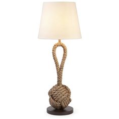 a rope lamp with a white shade on it