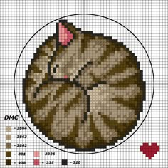 a cross stitch pattern with the image of a cat's head on top of it