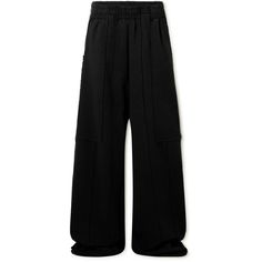 Vetements never plays it safe – its designs are constantly pushing the boundaries of shape, print and pattern. These sweatpants are made from strips of cotton-blend jersey and have super wide legs finished with exposed hems. Let them drop onto the label's chunky platform sneakers. Large to size. See Size & Fit notes. Sporty Cotton Wide Leg Pants With Straight Hem, Cotton Wide Leg Pants With Ribbed Cuffs, Cotton Wide-leg Pants With Ribbed Cuffs, Relaxed Fit Wide-leg Pants With Ribbed Cuffs, Relaxed Fit Wide Leg Sportswear Pants, Oversized Wide Leg Bottoms With Ribbed Waistband, Oversized Sweatpants With Ribbed Waistband, Streetwear Wide-leg Sweatpants With Elastic Cuffs, Oversized Streetwear Pants With Elastic Cuffs