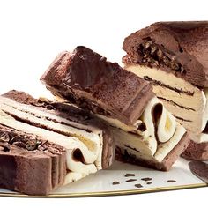 several pieces of cake sitting on top of a white plate