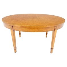 an oval wooden table with two legs