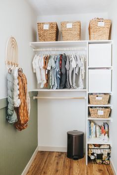 an organized closet with clothes and baskets