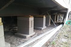 some concrete blocks are sitting in the middle of an under construction area that is being built