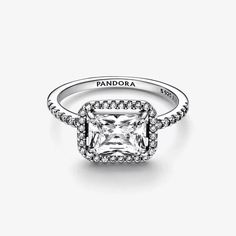 This stunning vintage-inspired ring is one you'll treasure forever. Crafted in sterling silver, this sophisticated Pandora Timeless ring is embellished with a halo of sparkling cubic zirconia stones and features a large rectangular radiant-cut stone as a stand-out centerpiece. Wear it on its own as a statement cocktail ring or style it with contrasting Pandora rings for a fresh, contemporary look. Cubic Zirconia & Sterling Silver Classic Sparkling Crystal Ring, Classic Diamond Crystal Ring With Sparkle, Classic Sparkling Diamond Crystal Ring, Classic Crystal Ring With Halo Design In Cubic Zirconia, Classic Cubic Zirconia Crystal Ring With Halo Design, Classic Sparkling Sterling Silver Diamond Ring, Rectangular Halo Cubic Zirconia Diamond Ring, Classic Sparkling Diamond Ring As Gift, Classic Halo Ring With Pave Setting For Gift