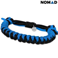 a blue and black rope bracelet with a silver charm on it's clasps