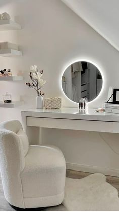 a white desk with a chair and mirror