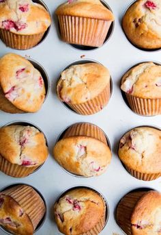 twelve muffins with fresh fruit in the middle