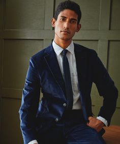 Our Fine Cord Sutton Suit offers a spin on a tailoring, if you’re looking for a suit that doesn’t feel like a suit, you’ve found it. The fabric — a fine navy corduroy with a hint of stretch for comfort — is from Portugal. This two-button jacket features design details like a partial lightweight lining (an excellent choice for warmer fabrics) and pick-stitching at the lapel, which gives it a handmade feel. The overall effect is clean and tailored, refined, but still easy-wearing. Corduroy is grea Blue Unstructured Denim Shirt, Luxury Garment Washed Men's Denim Jacket, Light Indigo Washed Button-up Denim Jacket, Indigo Unstructured Denim Shirt, Vintage Dark Wash Single-breasted Denim Jacket, Pick Stitch, Bleached Denim, Jacket Buttons, Contrast Stitch