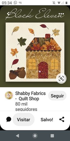 the app shows an image of a house with leaves on it and text that reads, shabby fabrics quilt shop