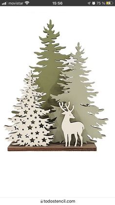 a paper cut out of a deer and trees