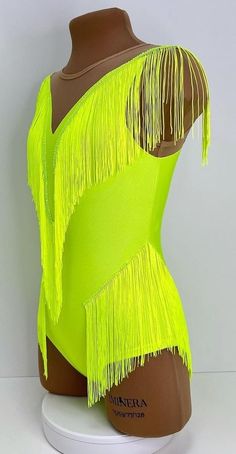 a mannequin with neon yellow fringes on it's back and sides