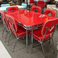 a room filled with lots of different colored chairs and tables on top of carpeted flooring