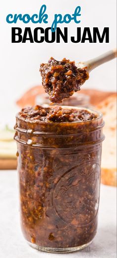 crock pot bacon jam in a glass jar with a spoon full of it and text overlay