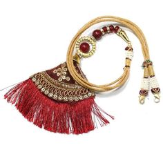 Back Splash - Red Zari Latkan Dori with red beads - Tassel for Necklaces
  Now show off not just your necklace but your back too .. Back Splash 
  Length of the Dori is adjustable upto : 24.00 inches
  This item is NOT made of Gold
  This item does NOT have any Gold in it
  Use this dori - Tassel to attach it to any Necklace
 - 1-DOR163 - in 0.000 Grams for USD $24.99. 
Made in India by Totaram Jewelers Online this product is in Gold - 22 Karat BIS Hallmark 916 KDM Gold  & is an excellent gi Necklaces Indian, Fancy Necklace, Cord Jewelry, Necklace Cord, Indian Necklace, Red Beads, Buy Necklace, Blue Topaz Earrings, Red Necklace