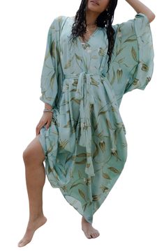 Perfect for poolside hangs or kicking it in the sand, this tie-front kaftan is the perfect accessory to add to your sun-loving wardrobe. V-neck Short sleeves 100% polyester satin Hand wash, line dry Imported Model stats: 5'10", 32" bust, 25" waist, 36" hip. Model is wearing size One Size. Breezy Wrap Cover-up For Vacation, Tropical Long Sleeve Cover-up For Beach Season, Summer Beach Cover-up With Tie Waist, Summer Beach Swimwear With Tied Details, Bohemian Flowy V-neck Swimwear, Spring V-neck Pool Cover-up, V-neck Swimwear With Tie Waist For Summer, Flowy V-neck Swimwear For Beach Cover-up, Flowy V-neck Beach Dress With Tropical Print