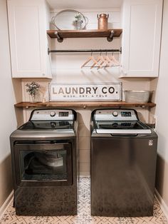 two washers and dryer in a laundry room