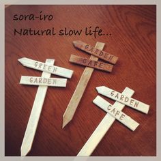 three wooden crosses that say garden cafe, garden cafe and sora - iro natural slow life