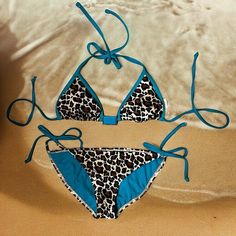 Summery And Colorful Leopard And Turquoise Target Xhilaration String Bikini Top And Swim Bottoms. Triangle Top With Light Padding And Turquoise Metal Adornment. Ties At Neck. Sz S. String Bikini Bottom. Leopard Print And Turquoise. High Cut Thigh. Moderate Bum Coverage. String Side Ties. Bottoms Washed But Never Worn. A Couple Minor Fabric Nits As Shown. Top Was Gently Worn And Laundered. Some Scratches On Metal Adornment And A Few Minor Nits On Fabric As Shown. Both Have Been Stored For A Few Y Stretch Turquoise Swimwear For Beach Season, Turquoise Beachwear Swimwear For Festival, Turquoise Summer Festival Swimwear, Summer Festival Turquoise Swimwear, Turquoise Stretch Swimwear With Triangle Top, Turquoise Triangle Top Stretch Swimwear, Thrift Ideas, Target Bathing Suits, Neon Bikinis