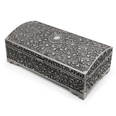 an ornate metal box is shown on a white background, with the lid open to show it's intricate design