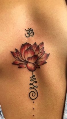 a woman's chest with a lotus tattoo on it