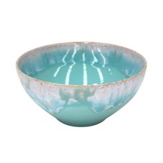 a blue bowl sitting on top of a white table