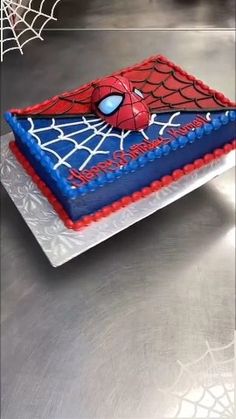 a spiderman birthday cake on a table