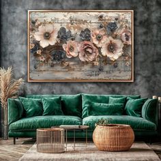 a living room with a green couch and large floral painting on the wall above it